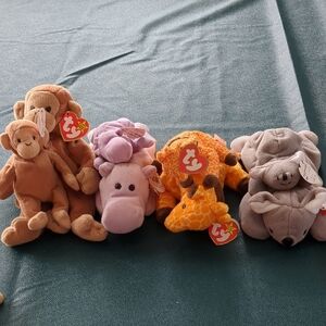 four matched sets  monkey,giraffe,koala,hippo.